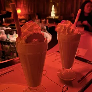 two milkshakes on a table