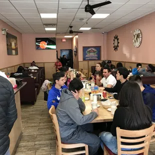 a group of people sitting at a table