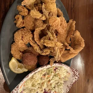 a plate of fried shrimp and coleslaw
