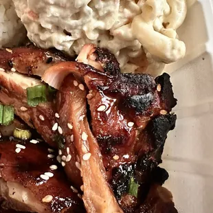 Teriyaki chicken, Mac salad and rice. The chicken charred dark just like I like it.