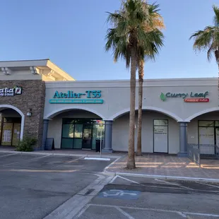 Store front with neighboring restaurants