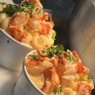 two bowls of pasta with shrimp