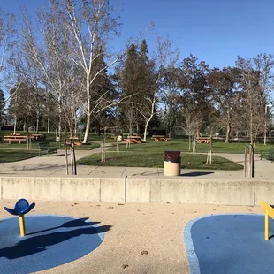 Picnic tables beyond the main playground