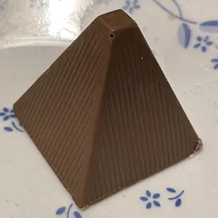 Milk chocolate with alcoholic filling (bourbon?) and an almond