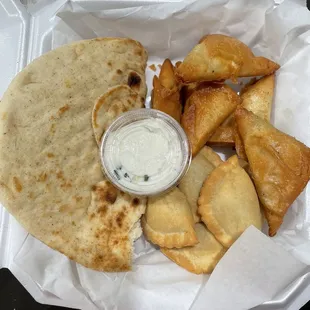 Pita bread, spinach pies, meat pies