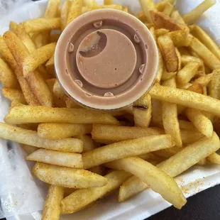 French Fries seasoned with salt and maybe paprika with their house secret sauce.