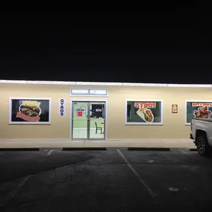 the front of the restaurant at night