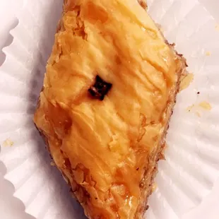 a piece of pie on a paper plate