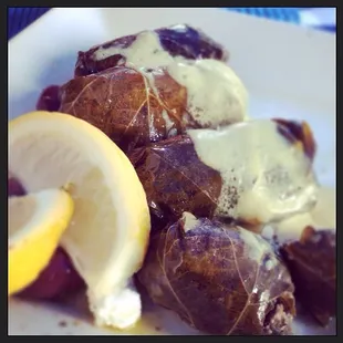delicious dolmades topped with a savory lemon sauce