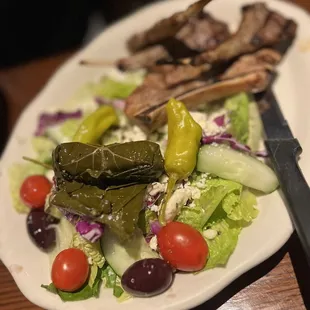 a plate of food with meat and vegetables