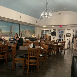 a dining room with tables and chairs