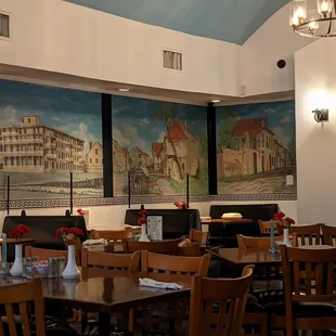 a dining room with tables and chairs