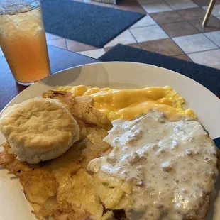 The country breakfast....Chicken Fried steak, eggs with cheese, homefries and a biscuit.