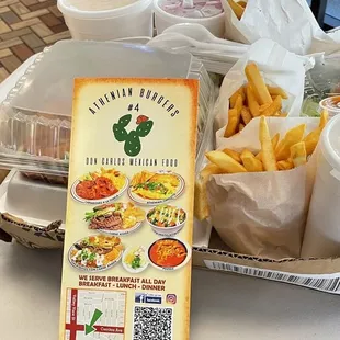 Cheese burgers with Fries, and fried jalapeños