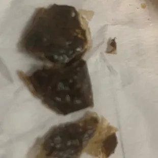 two pieces of fish on a piece of paper