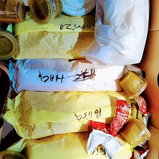 Breakfast burritos in the box ready to be tore up.