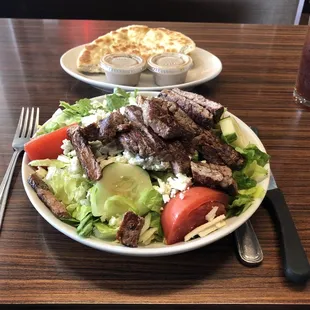 Athenian Balsamic Grilled Steak salad with side of pita.