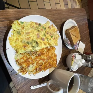 Western Omlette comes with Hash Browns and Toast. $13.  Add a bottomless cup of good coffee, $3.