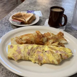 an omelet, toast, and coffee