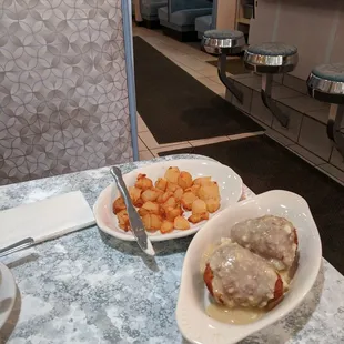 Chicken coquettes and deep fried potatoes.