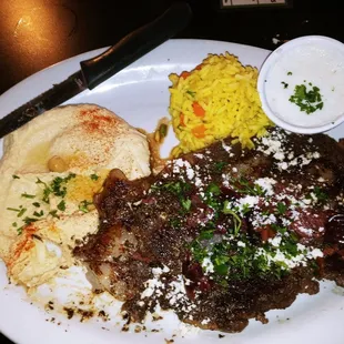 Greek Ribeye with hummus and Rice Pilaf.