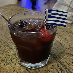 Nick The Greek custom made drink with Ouzo , Greek cherrys and vodka .