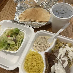 Gyro combo meal. Lamb, chicken, rice, hummus, pita, pop, salad.