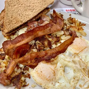 bacon, eggs, hash browns and toast