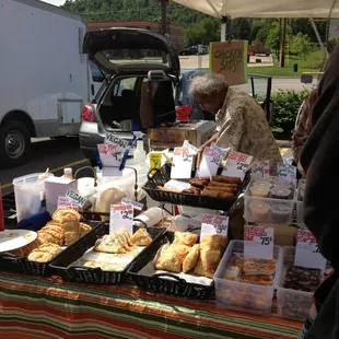 a woman selling pastries