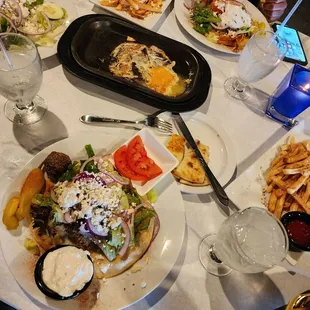 I had a falafel gyro and fries. My sister had a chicken gyro. My other sister had a salad and Greek fries. Cheese dip in the middle.