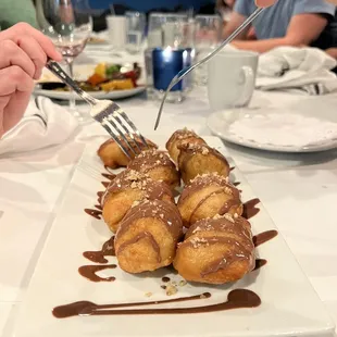 Loukoumades with chocolate syrup