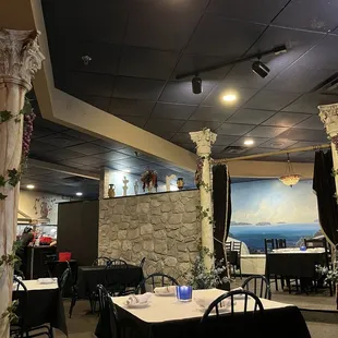 a dining room with tables and chairs