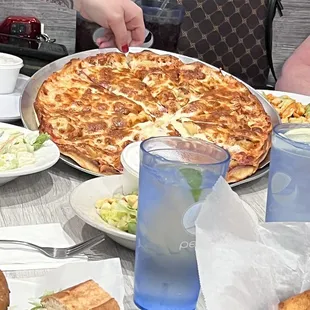 a large pizza and a salad