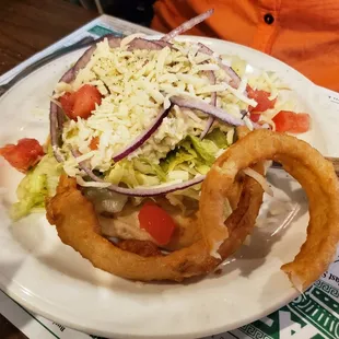 a plate of food with onion rings