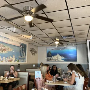 a group of people sitting at a table