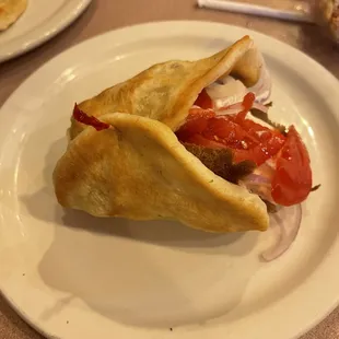 a pita sandwich on a plate