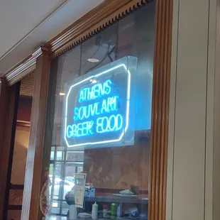 a neon sign in the window