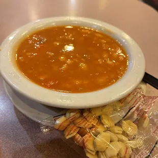 a bowl of soup and crackers