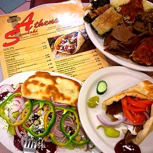 Greek traditional Salad, Greek combo platter n Gyro sandwich on house made Bread  Delicious