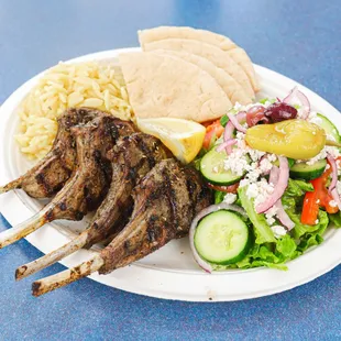 grilled lamb chops, salad, and pita bread