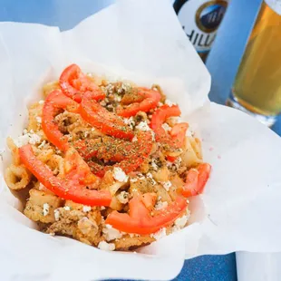 a plate of food and a glass of beer
