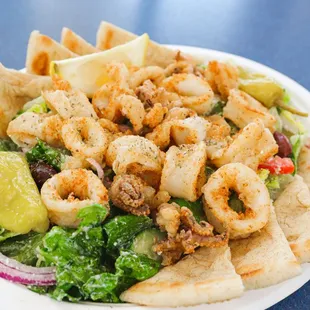 a plate of food with shrimp and tortillas