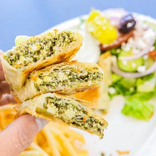 a person holding a plate of food