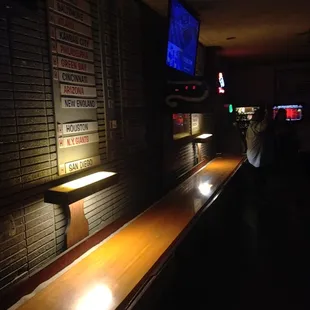 a long wooden shuffle table