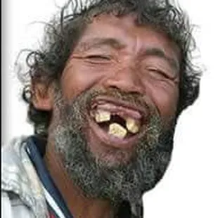 a man with a beard smiling