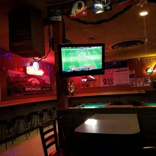 a pool table and a television