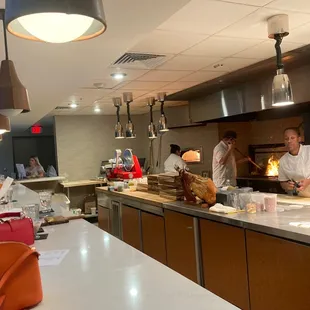 Kitchen vibe. Totally recommend to sit right in front of it!