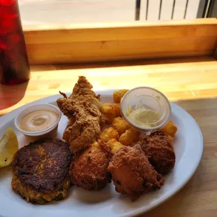 Combo basket, crab cake, hush puppies, fried spicy fish, and tater totts.