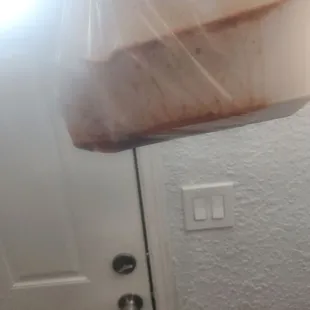 a plastic bag hanging from a door