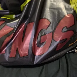 a black bag with yellow flowers on it